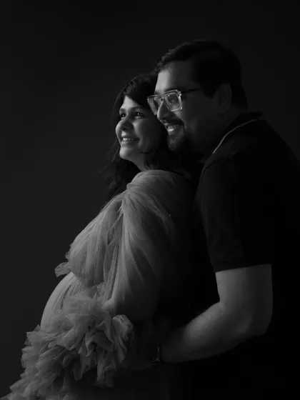 Embracing the shadows, illuminating the love. This intimate black and white shot brings out the depth of emotion and the beautiful bond between the couple.