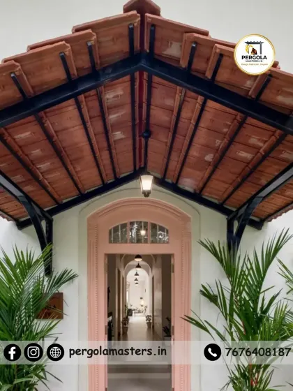 We blend traditional aesthetics with modern engineering. This entrance pergola features classic Mangalore tiles, offering natural cooling and timeless charm that adds a touch of heritage and elegance to the home's facade.