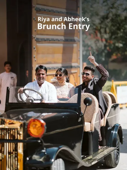 Your story is unique, and your entrance should be too. For this couple's brunch, we arranged a grand arrival in a vintage automobile, creating a joyful and stylish moment that set a celebratory tone for the rest of the day's festivities.