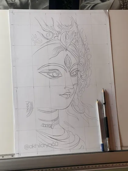 The gridded outline of Maa Durga on my drawing board. I use the grid method for larger or more complex pieces to ensure perfect proportions before I start shading.