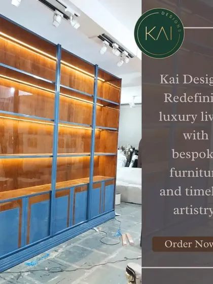 This large, bespoke shelving unit was designed for a commercial retail space. Finished in a bold blue lacquer with a natural wood interior and integrated lighting, it's built to make products stand out.