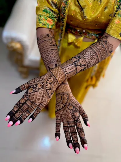 This angle shows the beautiful flow of the design on the back of the hands, ensuring your mehendi looks gorgeous from every perspective.