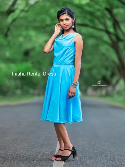 A front view of the sky blue short frock with a cowl neckline. It's a simple, elegant, and comfortable rental choice.