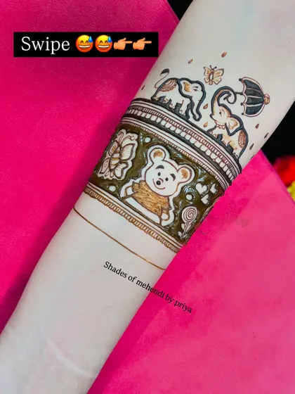 A clear shot of the top part of the arm design, showing the cute elephants and the teddy bear.