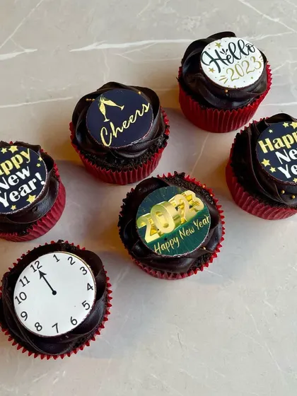 Our New Year's Eve cupcakes are perfect for parties. These chocolate cupcakes come with festive toppers to help you count down to the new year in style.