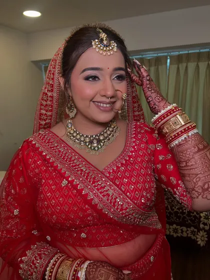 A playful moment captured. The makeup is designed to be long-lasting, allowing the bride to enjoy every moment without worrying about touch-ups.