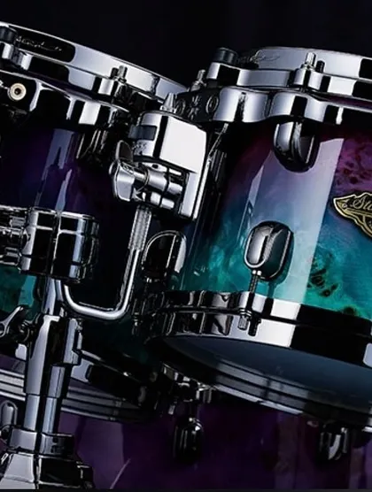 A close-up of the stunning finish on the Tama Starclassic Walnut Birch Special Edition drum kit. The unique grain and color fade make this kit a true work of art.