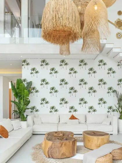 Our Island Palm Tree stickers create a stunning feature wall in this open-plan living area. The design adds a sense of height and a touch of tropical elegance to the room.