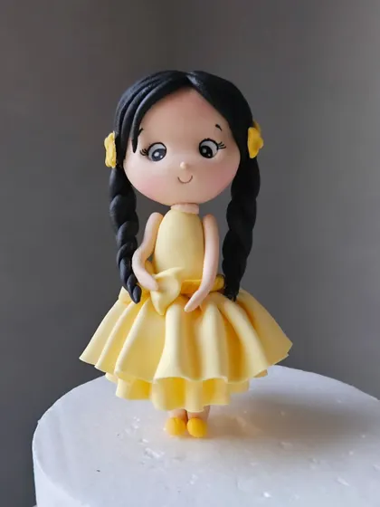 And this was mine! A cute figurine in a yellow dress. What should we name her?
