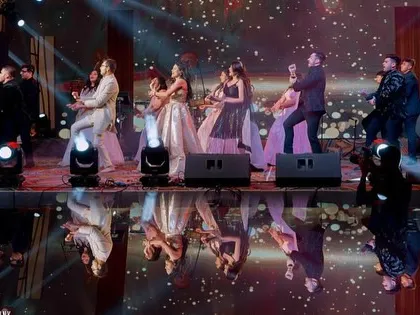 Another angle of the family 'jugalbandi', showing the energy and excitement of the performance.