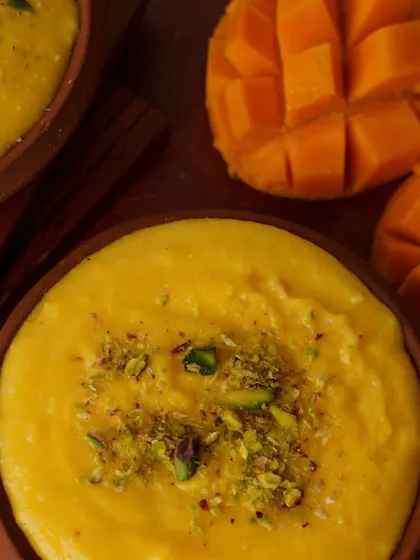 A rustic and traditional Aamras (mango pulp) dessert. We style to match the product, using earthy tones and textures to evoke a sense of authenticity.