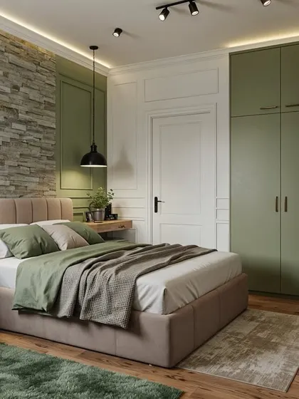 This bedroom concept combines a rugged stone accent wall with smooth, olive-green wardrobes. The contrast of natural stone and clean, colored panels creates a space that feels both earthy and modern.