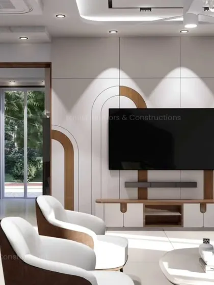 The media wall in this living room features a unique design with inlaid wooden arches on a white paneled surface. This creative detail adds a soft, architectural element to the room.