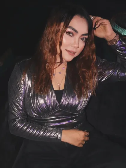 A relaxed moment during a gig, taking a break from the decks.