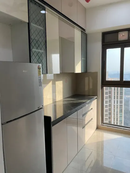 Another angle showing the efficient use of space, with patterned glass cabinets adding a decorative touch.