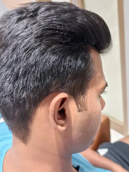 Another angle of a classic men's haircut, showing the clean lines and expert styling.