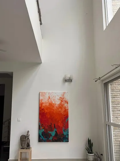 'The Uprising' shown in a double-height living space. The vertical orientation of the canvas complements the high ceiling perfectly.