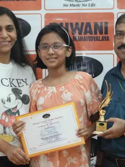 A student with her family and teacher, celebrating her achievement. The support of family is crucial, and we love to share these moments with them.