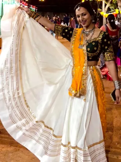 A joyful pose during a Navratri Garba night. My goal is to make you feel comfortable and radiant while you perform.