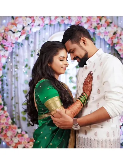 An intimate and romantic portrait of the newly engaged couple, surrounded by beautiful floral decor.