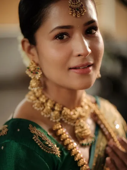 A close-up shot highlighting the intricate details of the temple choker and jhumkas. The craftsmanship is what makes these pieces so special.