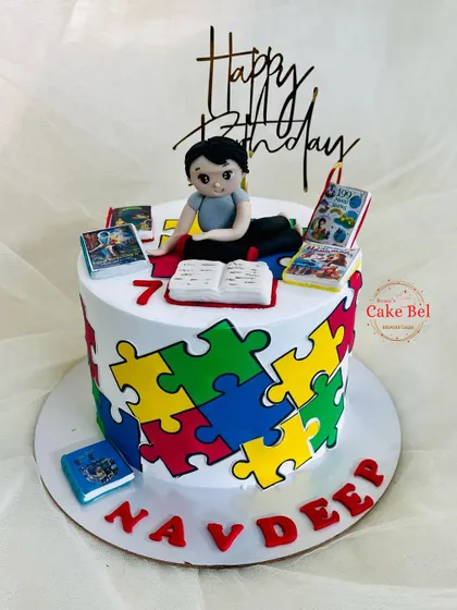 Another angle of the puzzle and mythological books cake.
