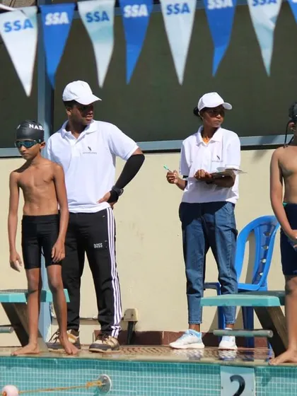 Our coaches and officials carefully watch over the young swimmers, ensuring a fair and safe competition for everyone.