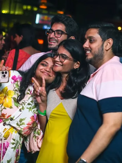 Friends taking a selfie at the Women's Day party. It was a night of joy and empowerment.