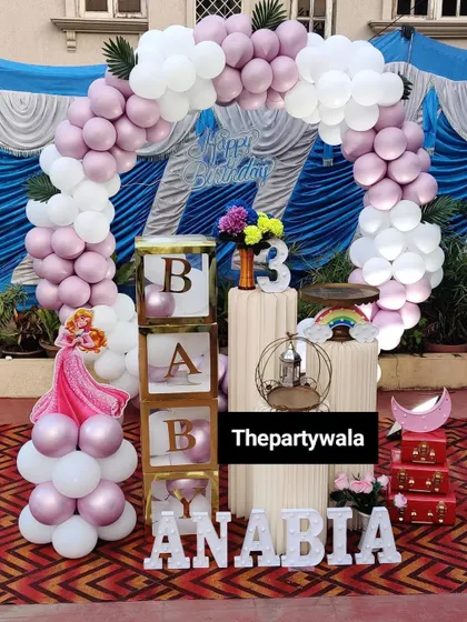 A sweet princess theme for a 3rd birthday, using a simple and elegant balloon arch with 'BABY' blocks.