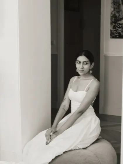 A quiet, seated portrait from my personal shoot in Paris. The simple white dress and elegant setting create a timeless feel.