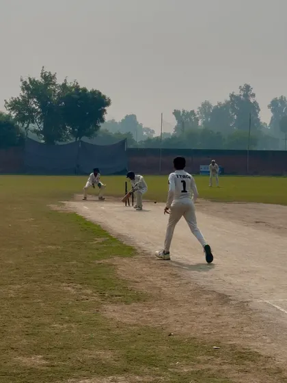 The bowlers celebrate an early breakthrough.