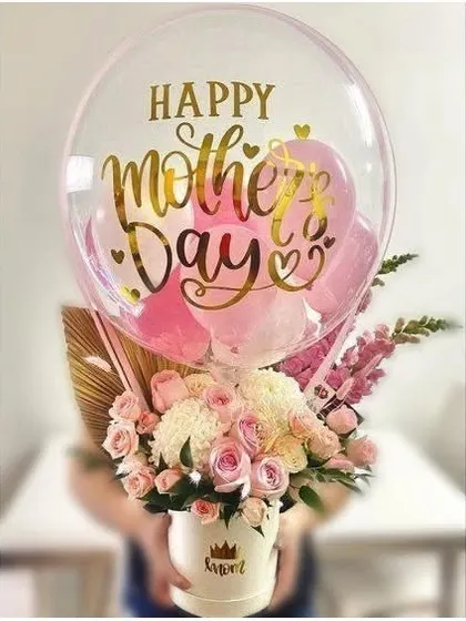 Happy Mother's Day. This stunning arrangement of fresh roses and chrysanthemums in a custom 'Mom' vase, complete with a personalized balloon, is a beautiful way to show your love.