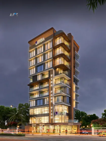 A nighttime render of Vira Park View. The lighting highlights the building's form and the interplay between its commercial and residential sections, creating a vibrant presence.
