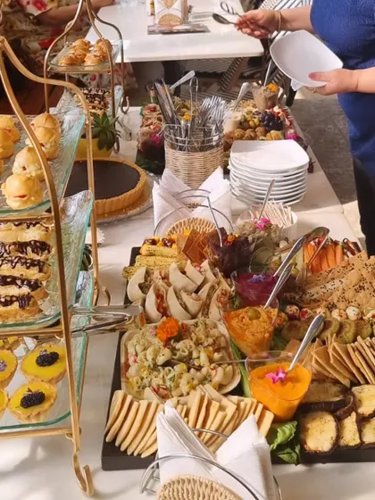 Our mini graze setup pairs tiered little desserts with sandwiches, crackers and dips, bringing a sharing spread to a smaller gathering.