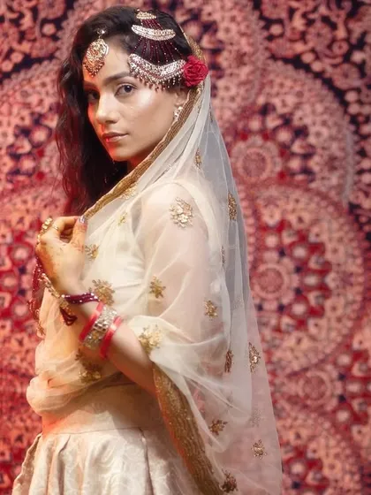 Moments from our Heeramandi-inspired shoot. These images showcase the intricate details of the makeup, hair, and styling, capturing the mood and opulence of the era.
