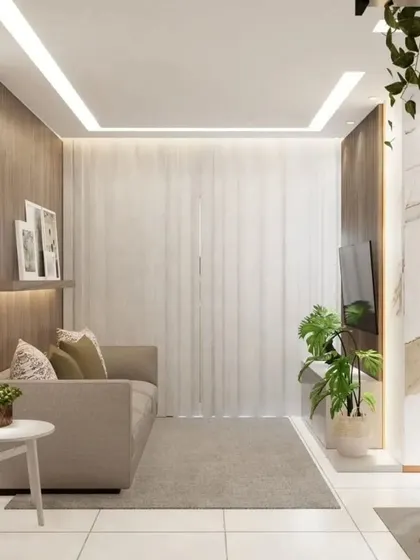 A full view of a compact living room, demonstrating how we use light colors, mirrors, and vertical lines to create an illusion of height and space.