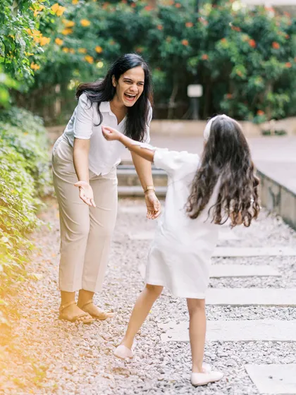 A mother and daughter playing and laughing together. The genuine connection and joy are what I strive to capture.