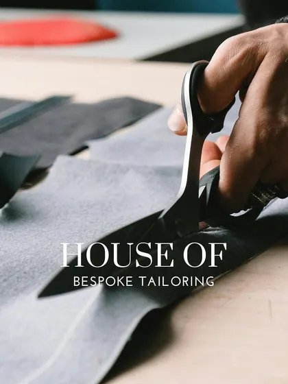 The tailor's shears are the first tool in bringing a design to life. This shot symbolizes the beginning of the bespoke journey, where raw fabric is cut with precision and intent.