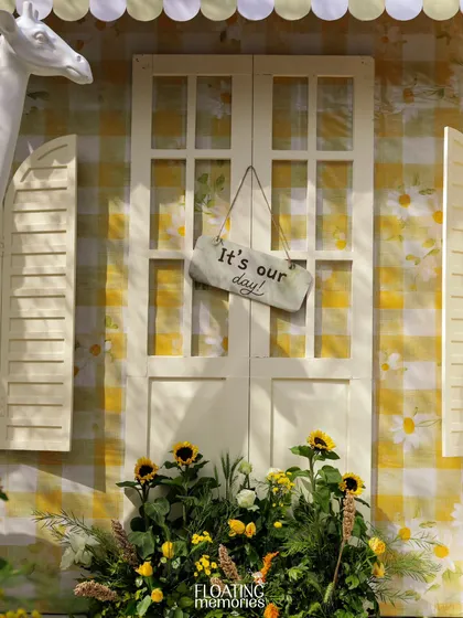 A custom "It's our day!" sign hangs on the door of the safari house, a sweet detail celebrating the special occasion.