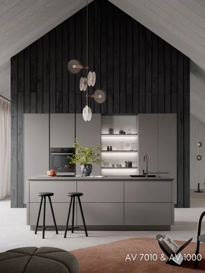 Another view of the AV 7010 & AV 1000 kitchen, showcasing the play of textures between the concrete-finish cabinets and the smooth, matte surfaces.
