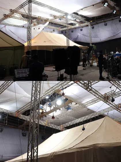 A wide shot of the tent setups inside the 'Chhaava' studio, with our lighting rigs built above and around them.