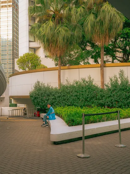 A quiet, landscaped corner in the middle of the city. Even in the most bustling metropolises, you can find serene spots for a moment of peace.
