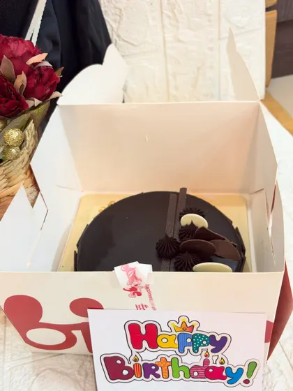 A delicious chocolate truffle cake included as part of the groom's special birthday and pre-wedding celebration gift.