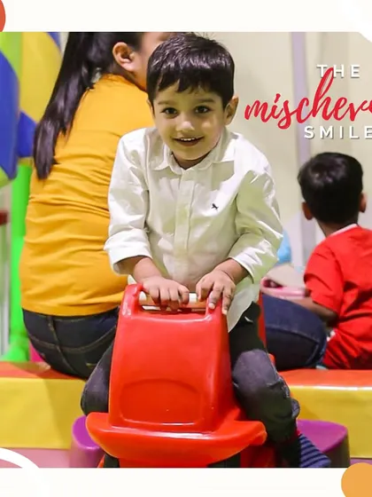 The mischievous smile. You know this little guy is having a blast and planning his next adventure on the rocking horse.