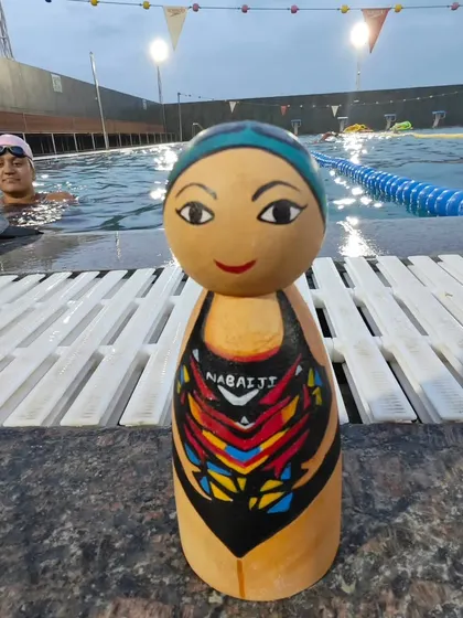 A hand-painted wooden doll of a swimmer, ready for our weekend classes at the temperature-controlled pool in Domlur. We have batches for all ages and levels.