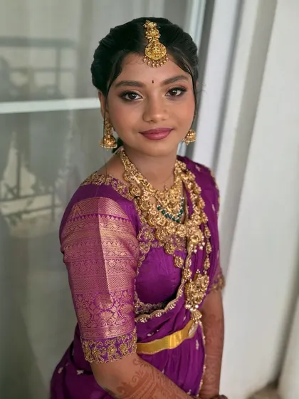Saanvi's happy smile shows how confident she felt. The makeup enhances her natural features, making her glow from within.