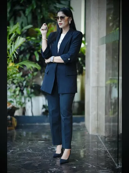 A classic "Boss Lady" pose. This image communicates confidence, professionalism, and authority, setting the tone for my leadership and motivational workshops.