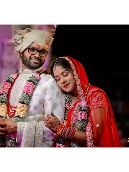 A sweet portrait of the couple, with the bride resting her head on the groom's shoulder.