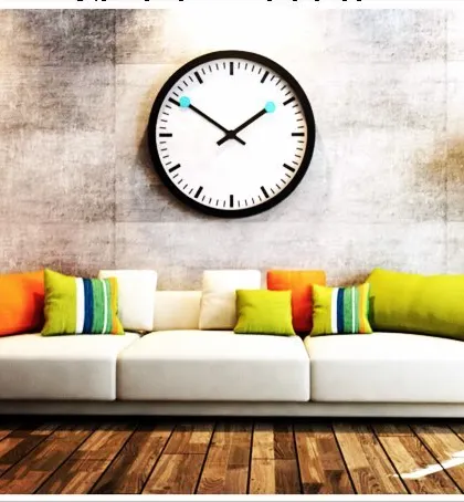 A neutral white sofa provides the perfect base for experimenting with color. Here, I've used a mix of bright orange and green cushions to add a fresh and lively feel to the living room, showing how easily you can change the mood of your space.
