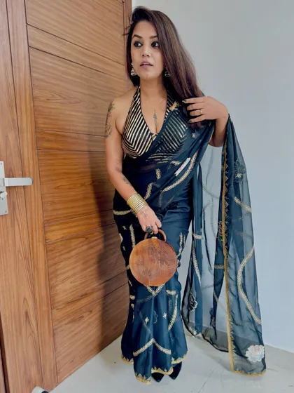 Another angle of this gorgeous client in our black and gold halter blouse. It's the perfect look for a Diwali party or a cocktail event.